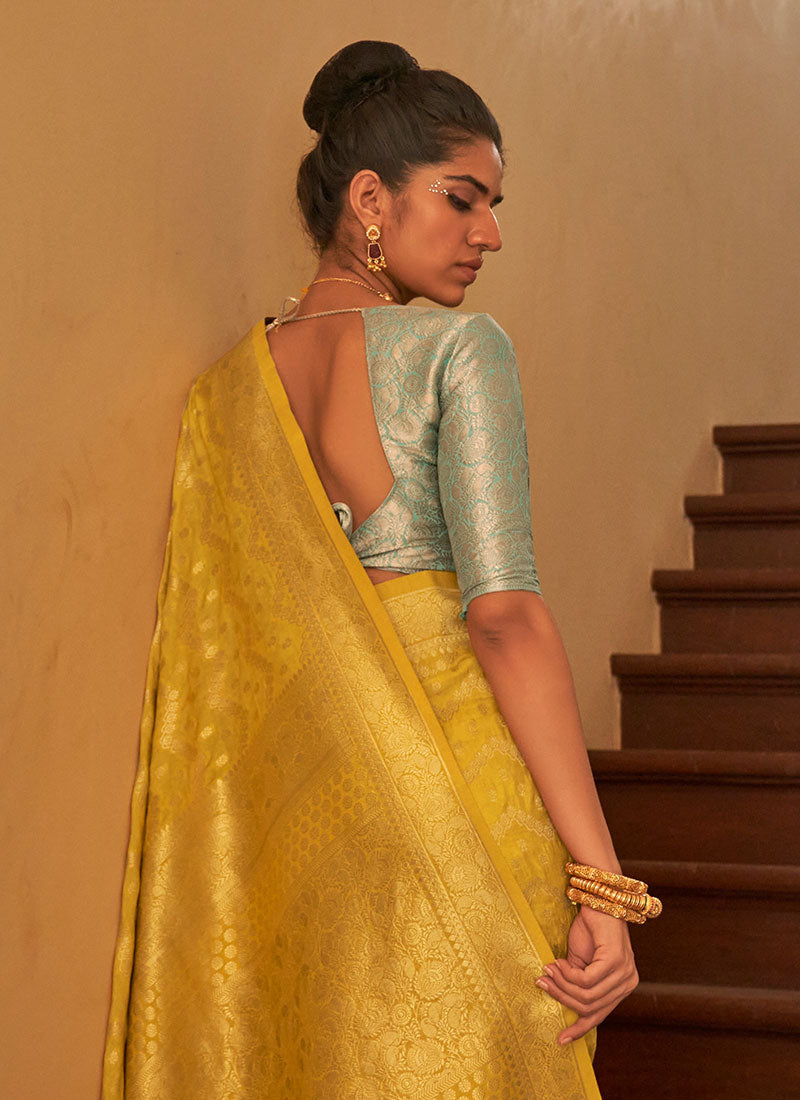 Yellow And Teal Weaved Crape Silk Saree