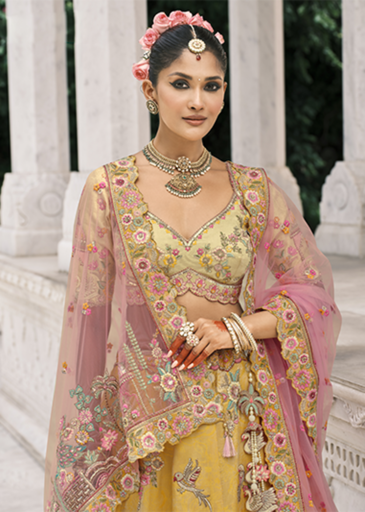 Cream–Teal Yellow Embroidered Silk Bridal Lehenga.