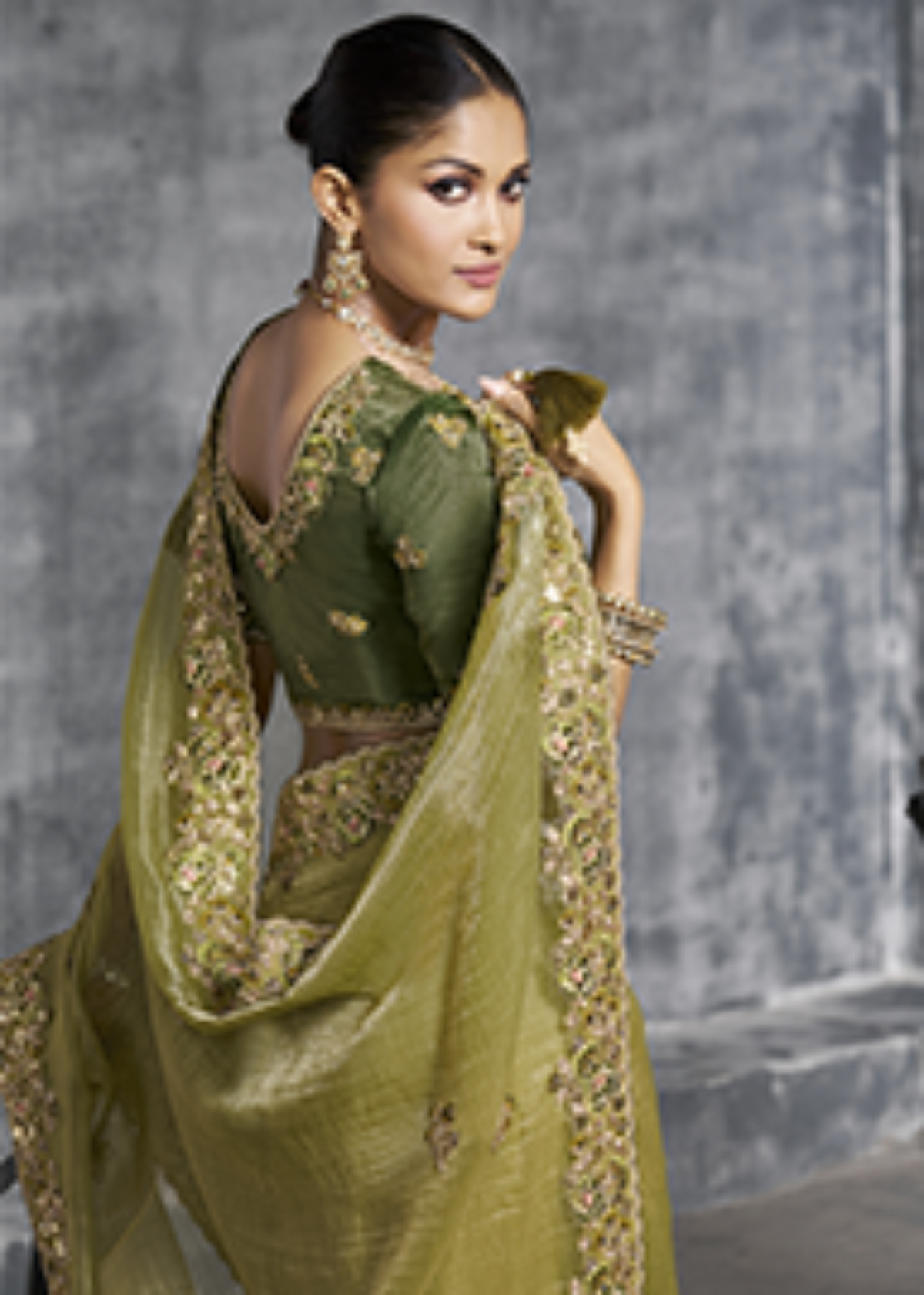 Olive Green Tissue Zari Embroidered Saree.