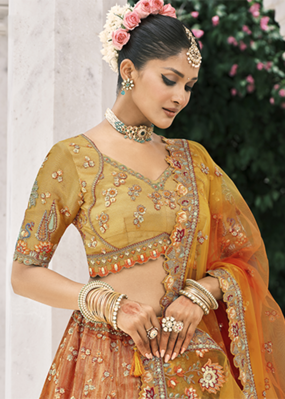 Orange Embroidered Silk Bridal Lehengaa.